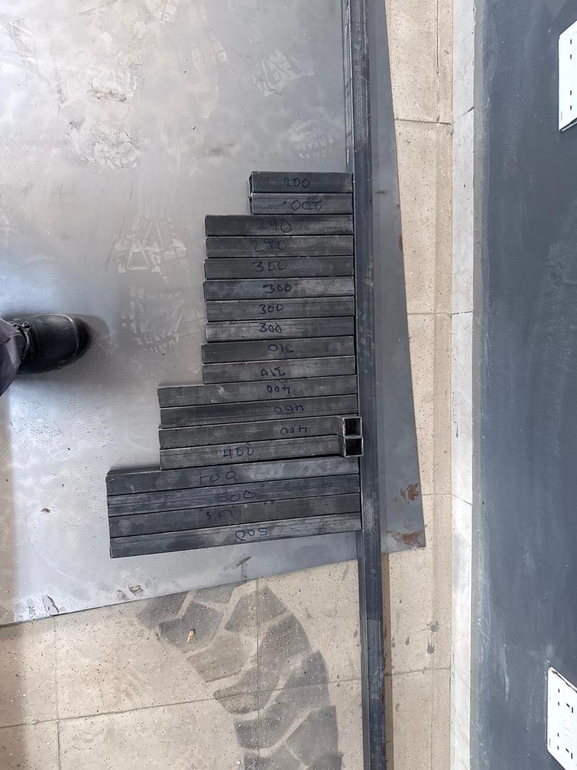 Precisely measured and cut steel square tube components for the ThreshWorks frame